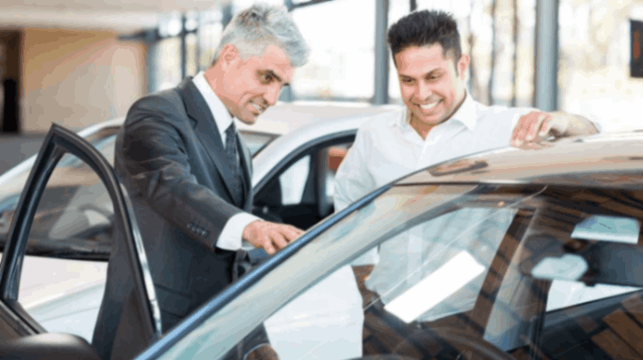 What is the average salary a car dealership salesman earns?